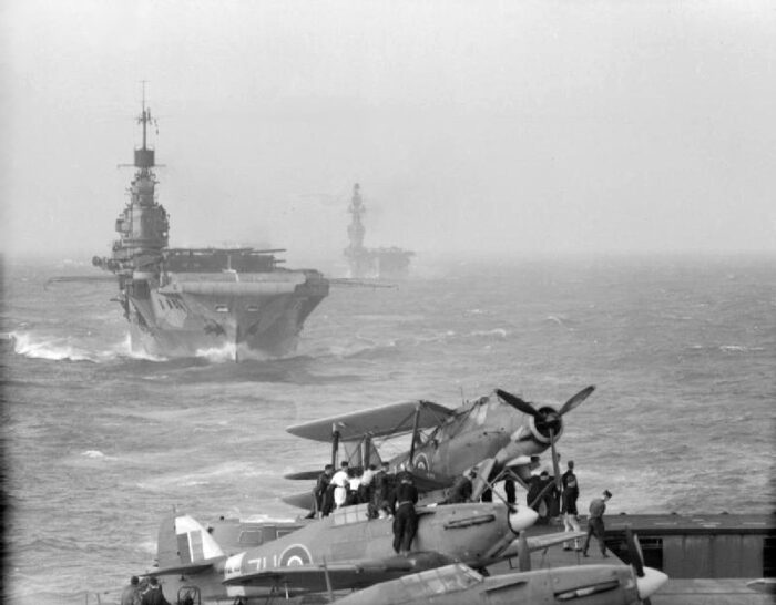 Photograph taken from the carrier HMS Victorious showing the carriers HMS Indomitable and HMS Eagle during Operation Pedestal. Source: Imperial War Museum. Photograph taken from the carrier HMS Victorious showing the carriers HMS Indomitable and HMS Eagle during Operation Pedestal. Source: Imperial War Museum.