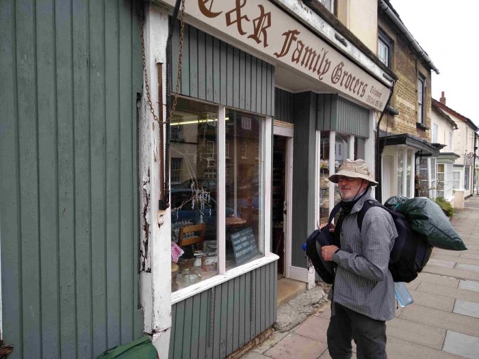 One hiker with bags in Cricklade High St One hiker with bags in Cricklade High St