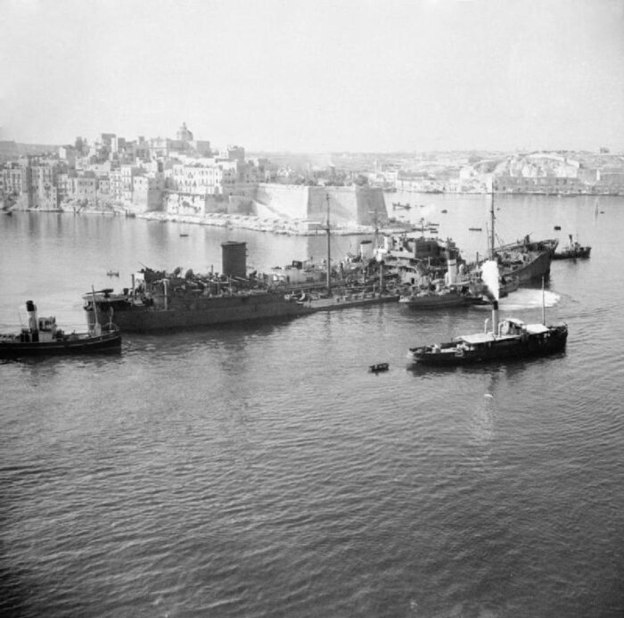 The tanker SS Ohio, supported by Royal Navy destroyers, approaches Valletta harbour after an epic voyage across the Mediterranean as part of convoy known as Operation Pedestal, August 1942. Source: Imperial War Museum. The tanker SS Ohio, supported by Royal Navy destroyers, approaches Valletta harbour after an epic voyage across the Mediterranean as part of convoy known as Operation Pedestal, August 1942. Source: Imperial War Museum.