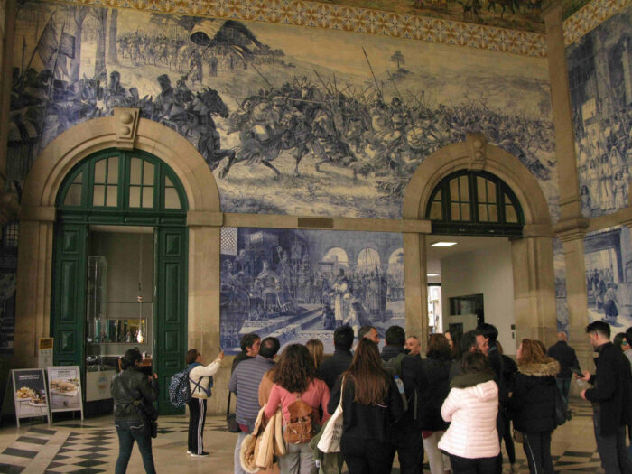 Travellers at Sao Bentho rail station Porto, © Philip Hunt, 2020 